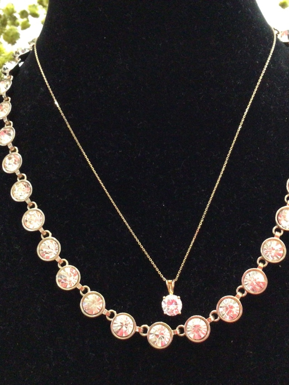 Two gold tone necklaces. The single cz is gold, plated sterling silver.